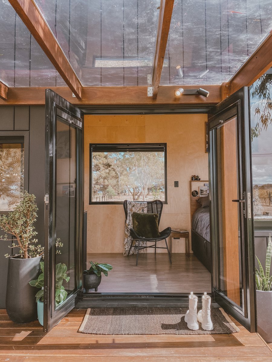 The glass doors open from the deck into the cabin